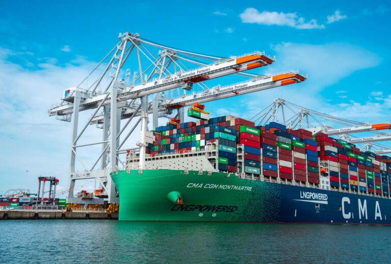 FEATURE: How important are technical regulatory details to accelerate the decarbonization of marine fuels and reach net zero by 2050? A crane loads CMA CGM’s Montmartre LNG-powered ultra-large containership in the harbor of Le Havre in France.