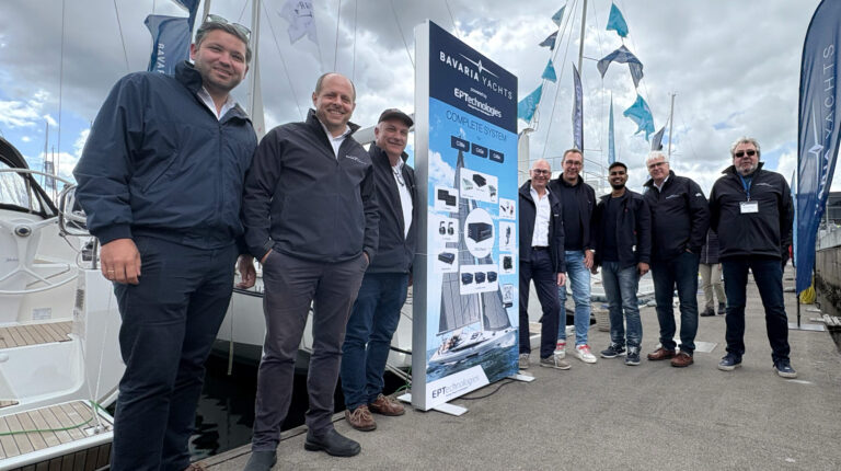 Norbert Leifeld, COO at Bavaria Yachts,stands quayside with other staff to mark the company's announcement that it is to equip vessels with EPTechnologies drives.