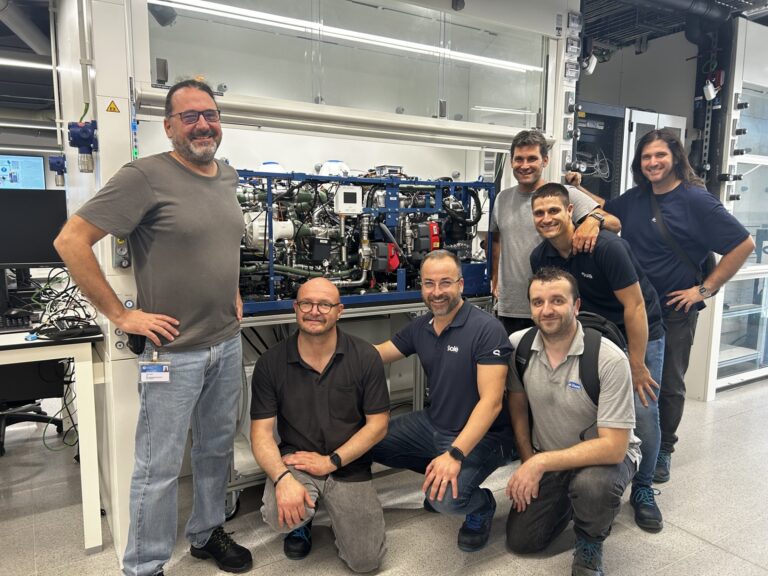 Solé Advance develops hydrogen fuel cell for marine propulsion and onboard power generation Solé Advance staff pose in front of fuel cell technology in a small laboratory environment
